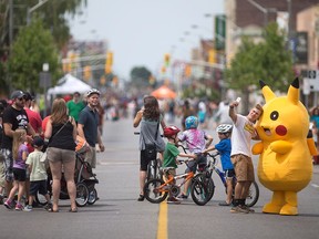 Cyclists and pedestrians in Walkerville enjoy 8km of streets closed to motor vehicles during Open Streets Windsor, Sunday, July 17, 2016.