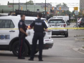 Windsor police officers investigate a suspicious package at the corner of Goyeau St. and Park St. in downtown Windsor, Saturday, July 9, 2016.