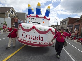 File photo. Members of Scouts Canada man a giant birthday cake in the Canada Day Parade on Wyandotte Street East in downtown Windsor, Friday, July 1, 2016.