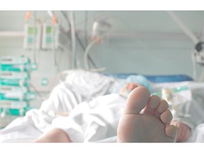 Patient in a hospital bed. Hospital stay. Photo by Getty Images.