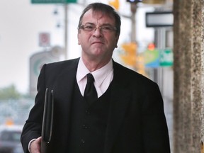 Rev. Robert Couture leaves the Superior Court in Windsor on Thursday, July 28, 2016 after sentencing submissions where heard on his theft conviction.