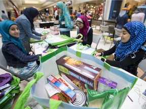 Volunteers help out at the Muslims of Windsor Share the Spirit of Ramadan at Devonshire Mall, Sunday, July 3, 2016. Organized by the Windsor Islamic Council, the event is raising money and food for local charities.