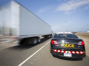 An OPP cruiser is pulled over on the shoulder of the QEW on Thursday, July 7, 2016.