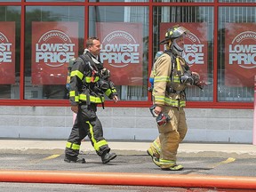 Windsor firefighters battle a blaze at the Staples store in the 7100 block of Tecumseh Rd E on Wednesday, July 27, 2016.