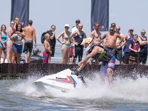 Members of the Can Am Watercross National Tour perform for people at the Belle River Sunsplash at Lakeview Park West Beach, Saturday, July 23, 2016.