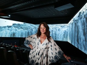 Gina Facca, general manager of Imagine Cinemas, shows off the multi-screen Barco Escape system at Lakeshore Cinemas on July 27, 2016.
