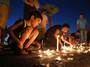 Members of Windsor's Iraqi community attended a vigil Tuesday night to commemorate the deadly bombing in Baghdad over the weekend.