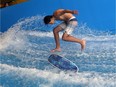 Kadd Cox rides the Flow Rider at the Windsor International Aquatic and Training Centre during a demonstration by professional flow riders in Windsor on Wednesday, July 20, 2016.