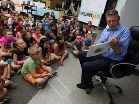 Devin Scillian, news anchor at WDIV-TV in Detroit, reads to students at the Catholic Education Centre in Windsor on Thursday, July 21, 2016.