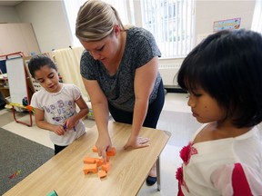 Teacher Megan Knight works with ESL students during a summer program at Dougall Elementary School in Windsor on July 5, 2016.