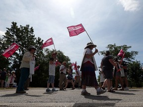 Essex County librarians take to the picket line in front of the Essex Civic building in Essex on Thursday, July 6, 2016. The striking workers were joined by other unions and CUPE National for a brief rally.