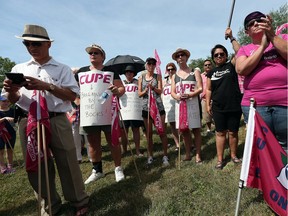 Essex County librarians take to the picket line in front of the Essex Civic building in Essex on Thursday, July 6, 2016. The striking workers were joined by other unions and CUPE National for a brief rally.