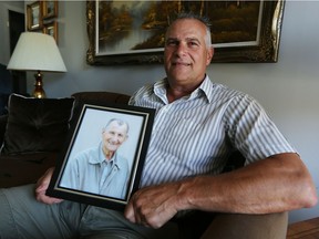 Dario Rossit holds a photo of his late father Vittorio in his home in Windsor on Wednesday, June 29, 2016. Rossit donated $15,000 to Assisted Living of Southwestern Ontario for the exceptional care his father received in the last year of his life.