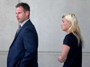 Windsor defence lawyer Evan Weber and Christina Albini leave Ontario Provincial Court on July 19, 2016. Albini is charged with sexual assault, sexual interference with a person under 16 and invitation to sexual touching and child luring.