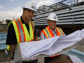 Max DeAngelis, left, of DeAngelis Construction works in 2012 with project manager Don Sadler at the site of the Windsor's Family Aquatic Centre. On Tuesday, DeAngelis Construction and STC Construction Group announced a merger of the two local construction firms.