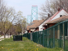 The Ambassador Bridge is seen in west Windsor on April 20, 2016.  Abandoned homes remain on Indian Road and several other west-end streets near the bridge.