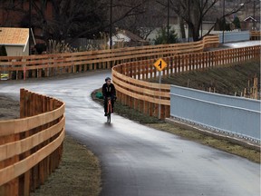 Oliver Swainson, a member of Bike Friendly Windsor Essex, takes a ride along Herb Gray Parkway trail system near Cousineau Road bridge on Dec. 22, 2015.