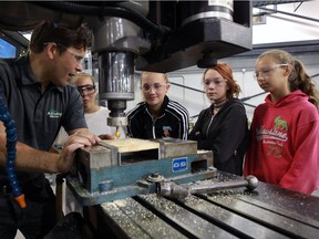 St. Clair College skilled trades instructor Rob Kobielski, left, instructs students Faye Hoster, 13, Samantha Clements, 13, Arial McCallum, 13, and Emily St. Croix, 12, right, during the Build a Dream program Thursday July 14, 2016.