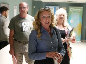 Nancy Pancheshan leaves with Ojibway supporters Wednesday after a city council committee decided to defer discussion of the proposed closure of Matchette Road.