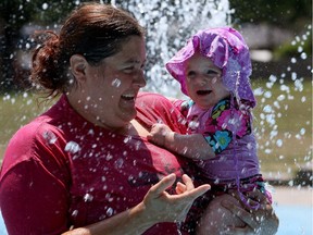 Sherry Foster holds her daughter Finlea Johnston, 11 months, at Mic Mac water park on Prince Road Wednesday July 20, 2016.