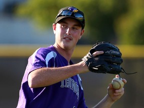 Connor Soulliere of Tecumseh Thunder Senior baseball club warms up before a game against Troy Jet Box at Soulliere Field on July 22, 2016.