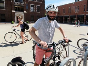 University of Windsor Students' Alliance president Moussa Hamadani sits on a bike at the U of W campus on July 22, 2016. Hamadani will introduce a bicycle-sharing program in the near future.