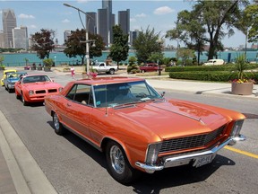 A Buick Riviera leads a group of classic, custom, street rods and muscle cars on to Ouellette Avenue Wednesday to promote the new Ouellette Car Cruise scheduled for Aug. 19 in downtown Windsor.  (NICK BRANCACCIO/Windsor Star)