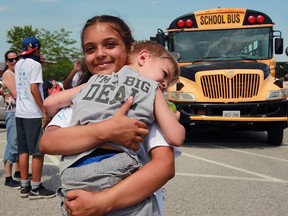 Camp Brombal student Avril Cote, 12, was greeted by her brother James Cote, 3, arriving back at Safety Village after spending a week away at the summer camp supported and operated by Windsor Police Services July 7, 2016.
