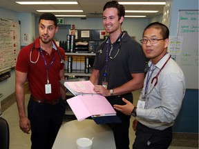 Moe El-Youssef, left, David Morden and Carl Ren, right, third-year medical students from Windsor campus of Schulich School of Medicine, are part of the Clinical Teaching Unit team at Windsor Regional Hospital's Ouellette Avenue Campus Friday July 8, 2016.