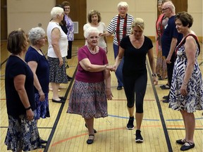Kelly Steele, centre right, and Scottish country dance partner June Dey, 84, perform with members of the Royal Country Dance Society perform at Bedford Church Hall Wednesday May 25, 2016.