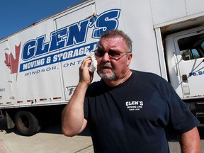 Glen Cook of Glen's Moving wipes sweat from his face during a busy morning Thursday July 21, 2016. Cook's phone has been ringing constantly during the area's recent real estate boom.