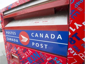 A Canada Post mailbox is seen at a sorting centre in Montreal, Friday, July 8, 2016. The Canadian Union of Postal workers has called for a 30-day truce to negotiate a new contract and avoid a strike or lockout. THE CANADIAN PRESS/Ryan Remiorz ORG XMIT: RYR105