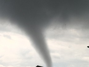 A funnel cloud is seen in the sky above a LaSalle home on August 25, 2016. (Geno Olivastri/Special to The Star)