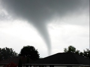 Tom Greer and his girlfriend Ilde Leplattenier were stunned to see a funnel cloud forming over LaSalle Wednesday night but Leplattenier had the presence of mind to grab her phone and start recording.