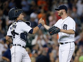 James McCann #34 of the Detroit Tigers celebrates with pitcher Mark Lowe #21 of the Detroit Tigers after a 11-5 win over the Chicago White Sox at Comerica Park on August 2, 2016 in Detroit, Michigan. (Photo by Duane Burleson/Getty Images)