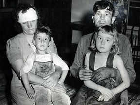 June 19, 1946: Daniel Puskas of Sandwich West undoubtedly saved the lives of his wife and two children when he hurled the children under a haystack, covered his wife with hay and then laid on top of the pile to keep the hay in place when he saw the twister coming. The Puskases are shown with their children Daniel, 4, and Ethel, 6. The youngsters told how the hay was swept away by the tornado leaving them on the ground unharmed. Mrs. Puskas later was struck on the head by a 2x4 flying through the air.