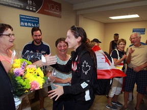 Olympian Noelle Montcalm, centre, is greeted by dozens of friends, supporters and family at Windsor Airport Wednesday August 24, 2016. (NICK BRANCACCIO/Windsor Star)