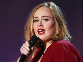 In this Feb. 24, 2016 photo shows Adele onstage at the Brit Awards 2016 at the 02 Arena in London. Adele will play the Palace of Auburn Hills, Mich., on Sept. 6.
