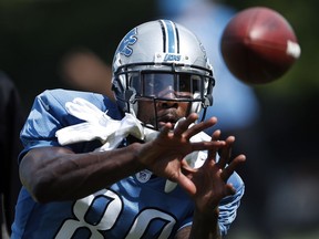 Detroit Lions wide receiver Anquan Boldin catches a pass during NFL football practice in Allen Park, Mich., Monday, Aug. 1, 2016.