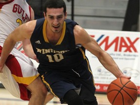 Windsor Lancer Mike Rocca drives to the basket during OUA men's basketball action Nov. 8, 2014.