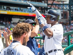 Justin Upton (8) of the Detroit Tigers celebrates hitting a three-run home run in the third inning with teammates in the dugout during a game against the Boston Red Sox at Comerica Park on Aug. 21, 2016 in Detroit, Mich.