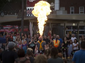 Pyromancer breaths fire in front of a large crowd at the Walkerville Buskerfest Saturday, Aug. 13, 2016.