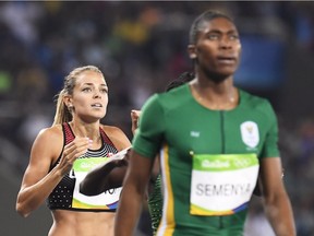 Canada's Melissa Bishop, left, reacts to her fourth-place finish in the women's 800 metres final behind South Africa's gold medallist Caster Semenya at the 2016 Summer Olympics in Rio de Janeiro, Brazil.