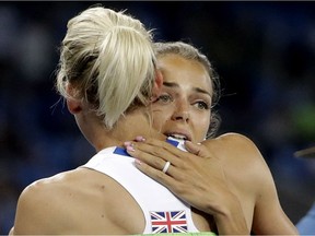 Canada's Melissa Bishop, right, embraces Britain's Lynsey Sharp after placing fourth in the women's 800-metre final during 2016 Summer Olympics in Rio de Janeiro, Brazil on Aug. 20, 2016.