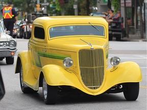 Classic cars roll down Ouellette Avenue during the Ouellette Car Cruise event on Friday, August 19, 2016.