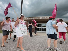 Striking CUPE library workers picket in front of the Essex Library on Aug. 17, 2016 where library board members were holding a closed door meeting.