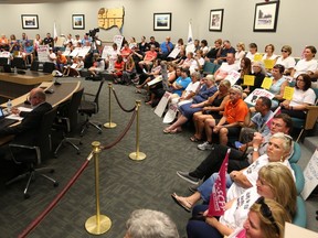 Local union members showed support for striking library workers at the Essex County Council meeting in Essex Aug. 10, 2016. (JASON KRYK/Windsor Star)