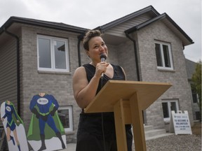 Charmaine Nippers speaks during the unveiling of her new home built by Habitat for Humanity, Saturday, Aug. 13, 2016.