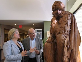 TECUMSEH, ONTARIO- JULY 25, 2014 - Provincial NDP leader Andrea Horwath met with Tecumseh mayor Gary McNamara on Friday, July 25, 2014, to discuss the Bonduelle fire aftermath. The mayor shows Horwath a sculpture of Chief Tecumseh in the town hall.  (DAN JANISSE/The Windsor Star)