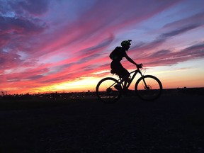 Avid cyclist Kyle Colautti rides his performance mountain bike at the top of Malden Park hill in Windsor  on Aug. 8, 2016.